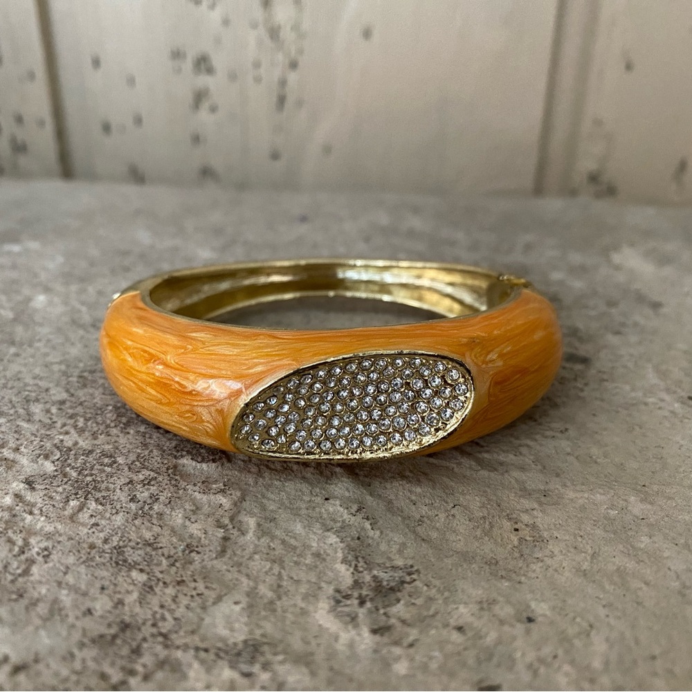 Metal and enamel hinged bangle bracelet with rhinestones